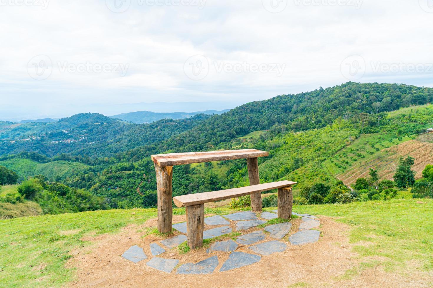 wood bar and chair with mountain hill background photo