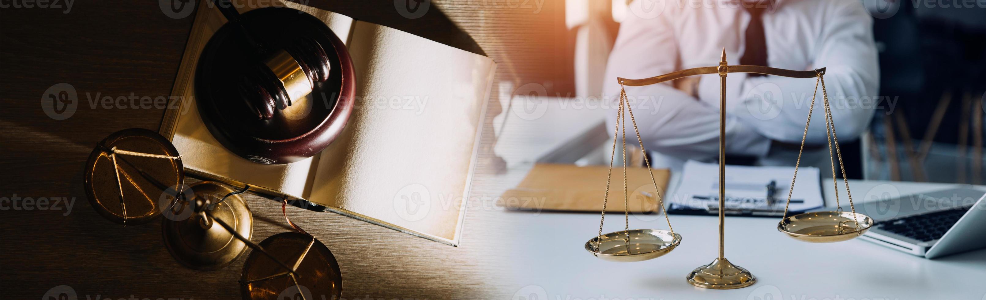 Business and lawyers discussing contract papers with brass scale on desk in office. Law, legal services, advice, justice and law concept picture with film grain effect photo