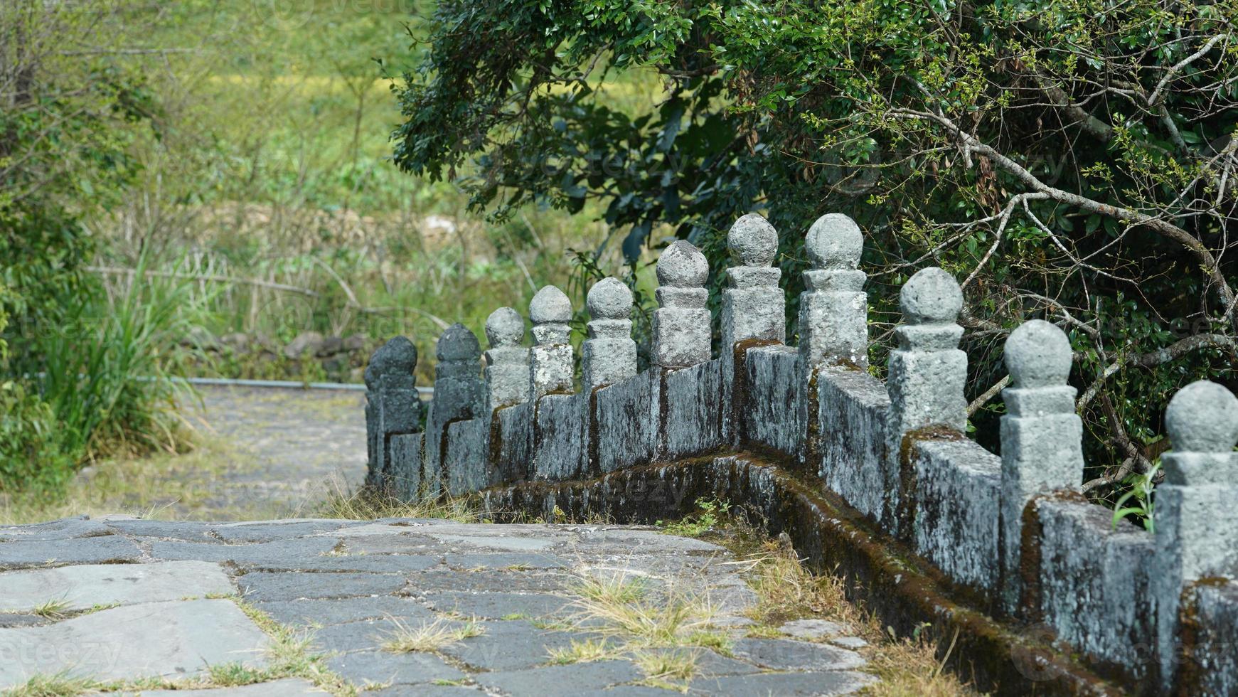 The old stone bridge view with the ruined sculptures in China photo