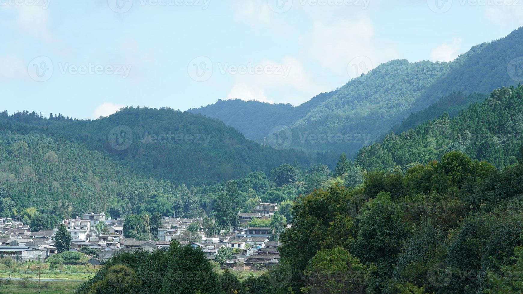 The beautiful mountains view with the cloudy sky and valley among them photo