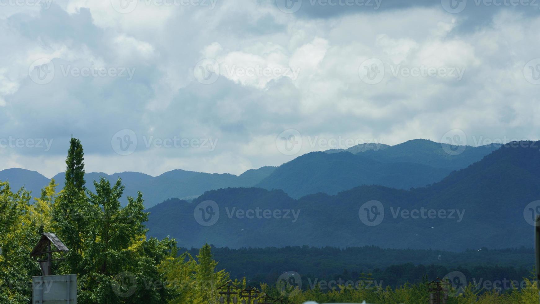 The beautiful mountains view with the cloudy sky and valley among them photo