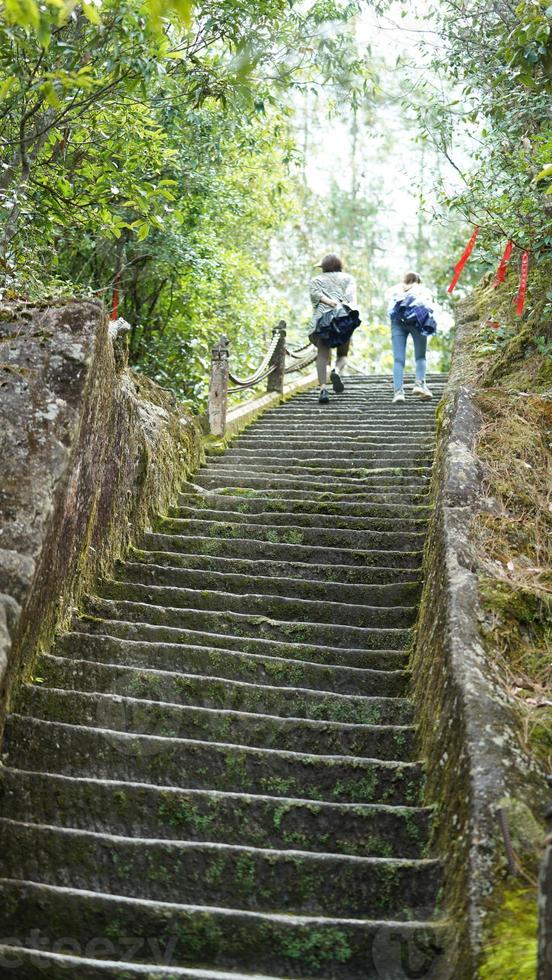 The steep stairs used to climb the mountains in the countryside of the China photo