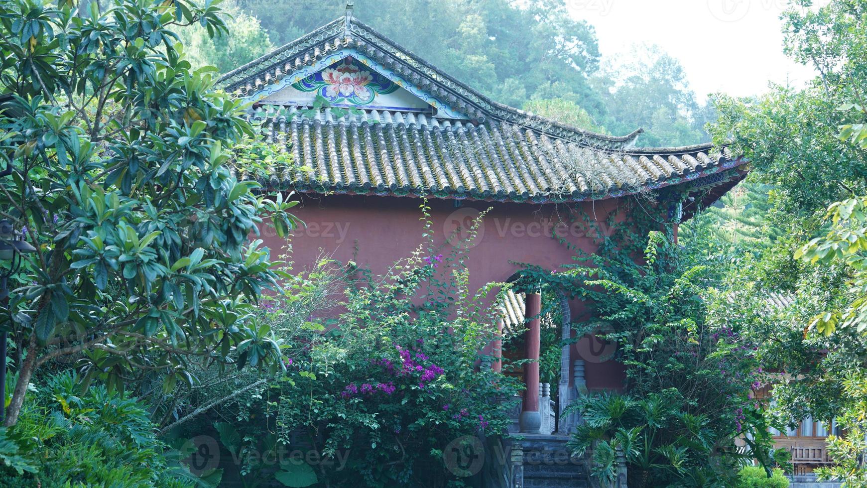 The old temple view with the ancient Chinese buildings located on the top of the mountains photo