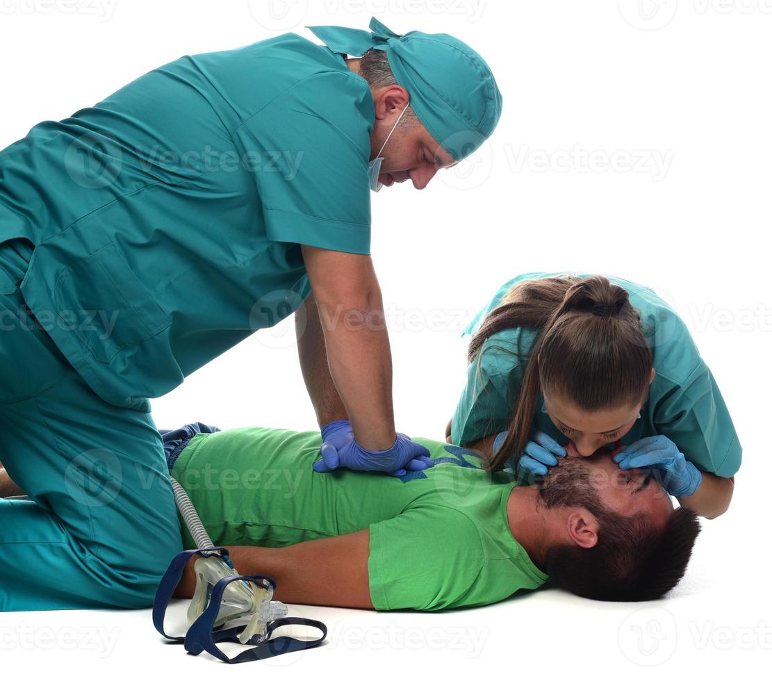 Female doctor with medical team giving cpr to patient. photo