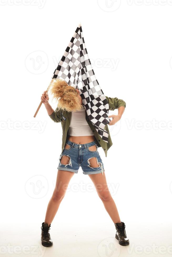 beautiful model holding finish flag isolated on white background. motorsport finish flag in hands of a female model. photo
