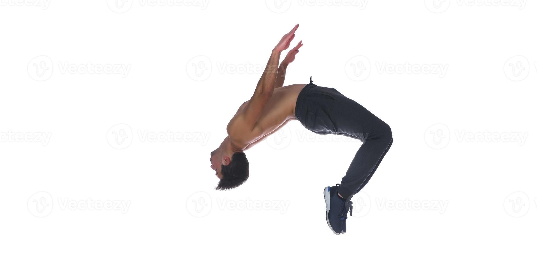 Cool young break dancer performing in studio on white background. photo