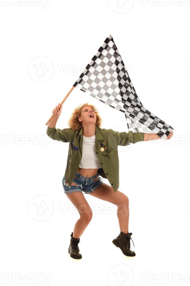 beautiful model holding finish flag isolated on white background. motorsport finish flag in hands of a female model. photo
