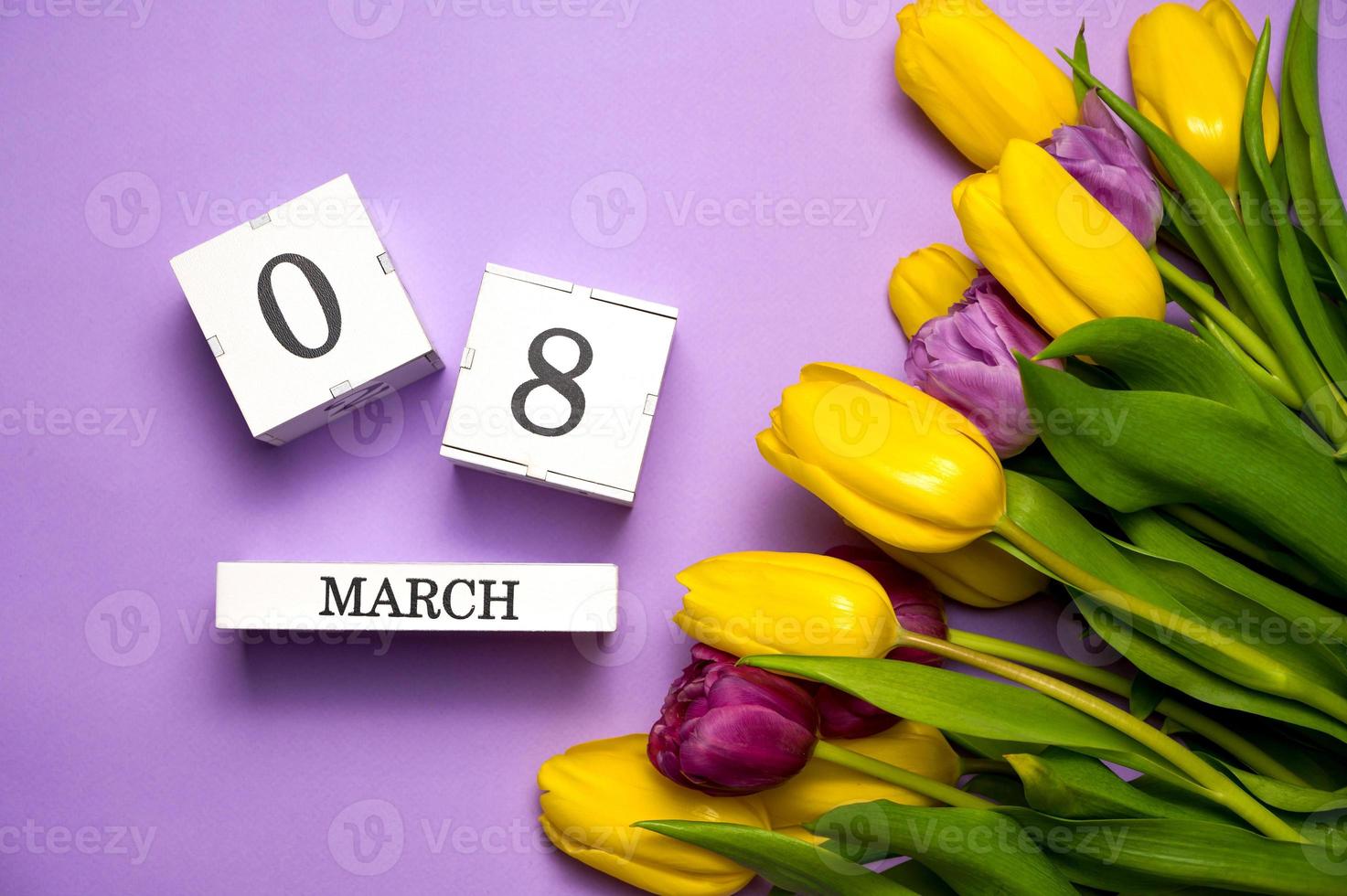 8 march concept. Colorful tulips on pastel purple. International women's day photo