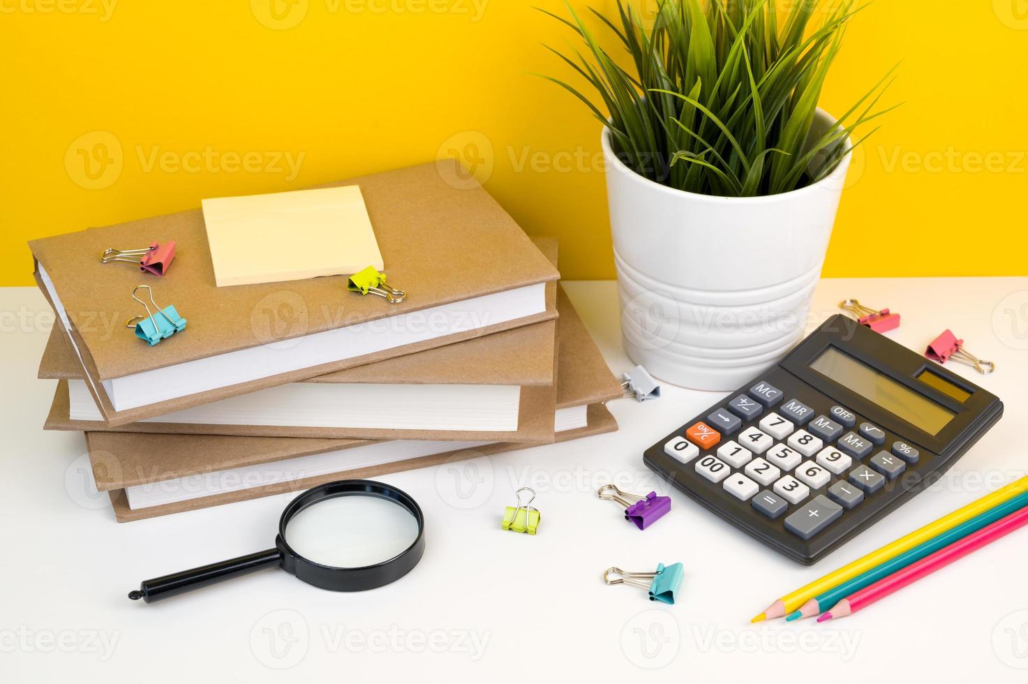 Top view on school supplies. Books,pushpins,calculator,pencils etc. Back to school photo