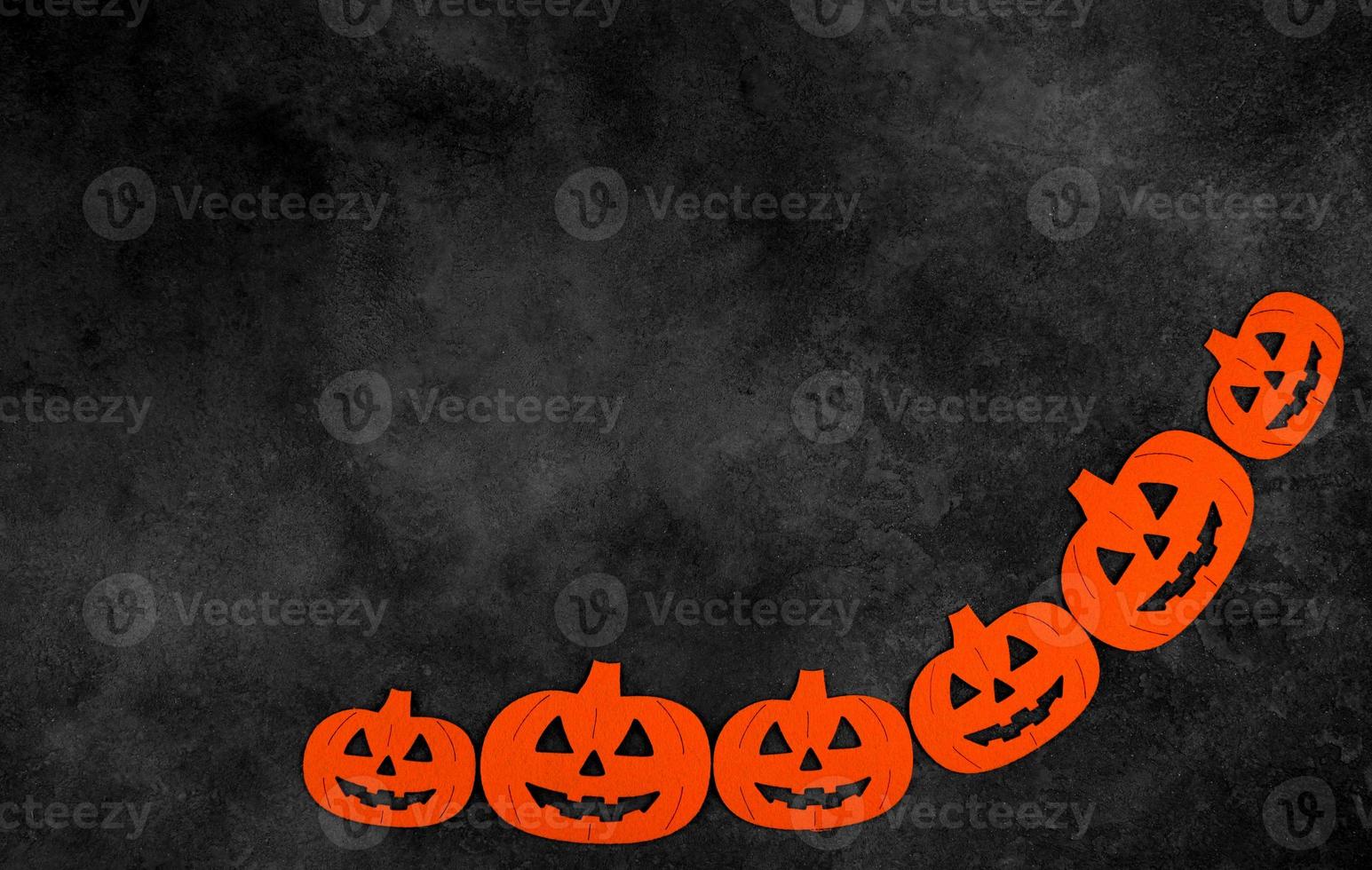 Dark mystery halloween flat lay with orange pumpkins.Copy space banner photo