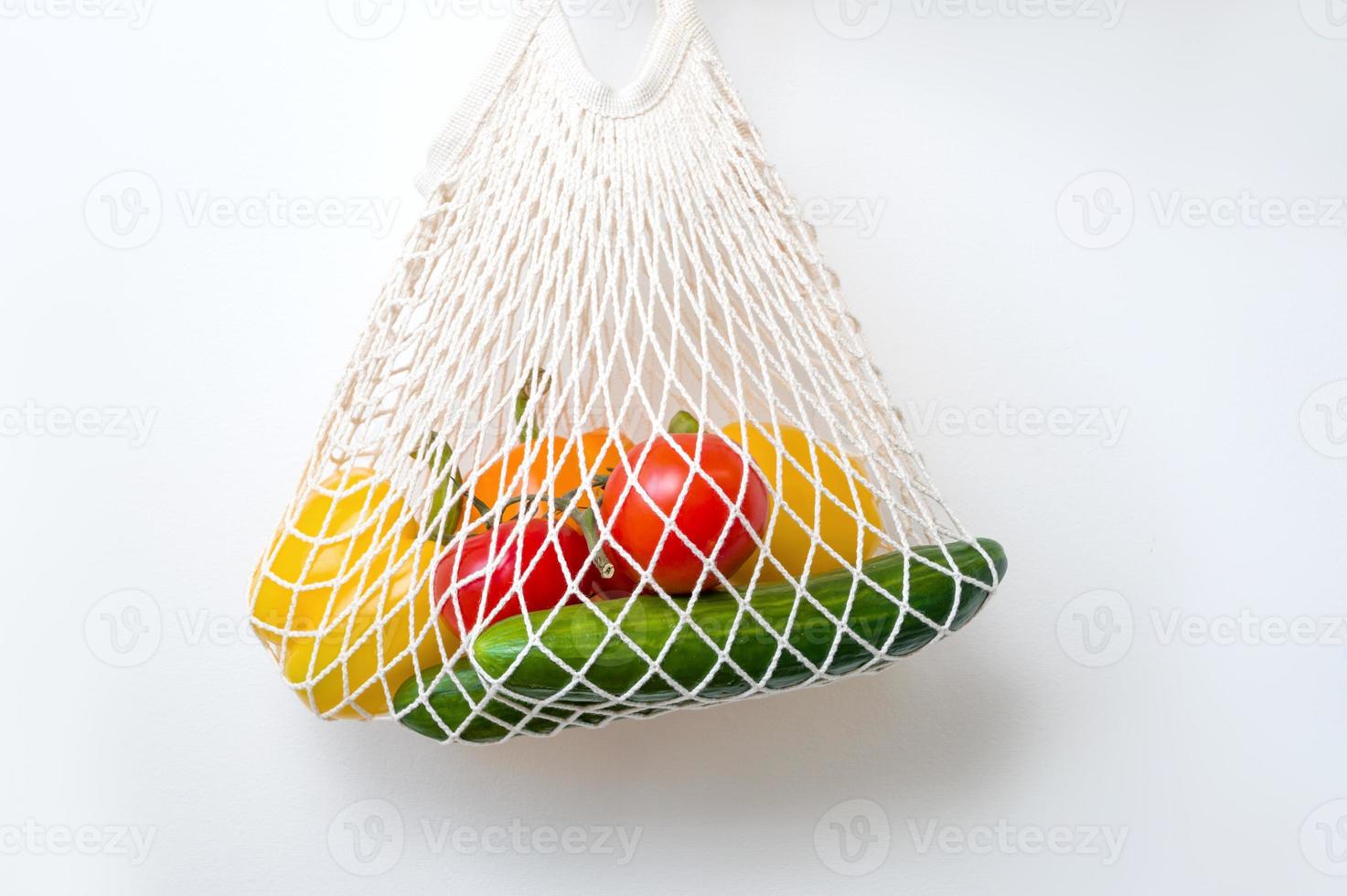 Closeup of eco-friendly shopper with fresh veegtables. Sustainable shopping concept.Healthy eating photo
