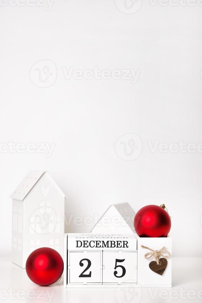 Christmas Vintage Wood Calendar with red ornaments and date december 25. Vertical banner with place for text photo