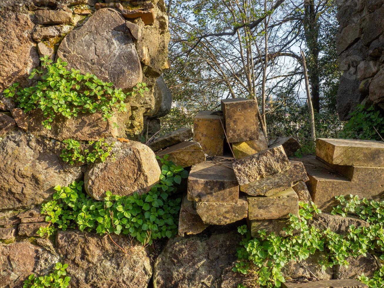 Ancient slabs from the temple. Restoration work. Part of an ancient masonry. Remains of history. photo