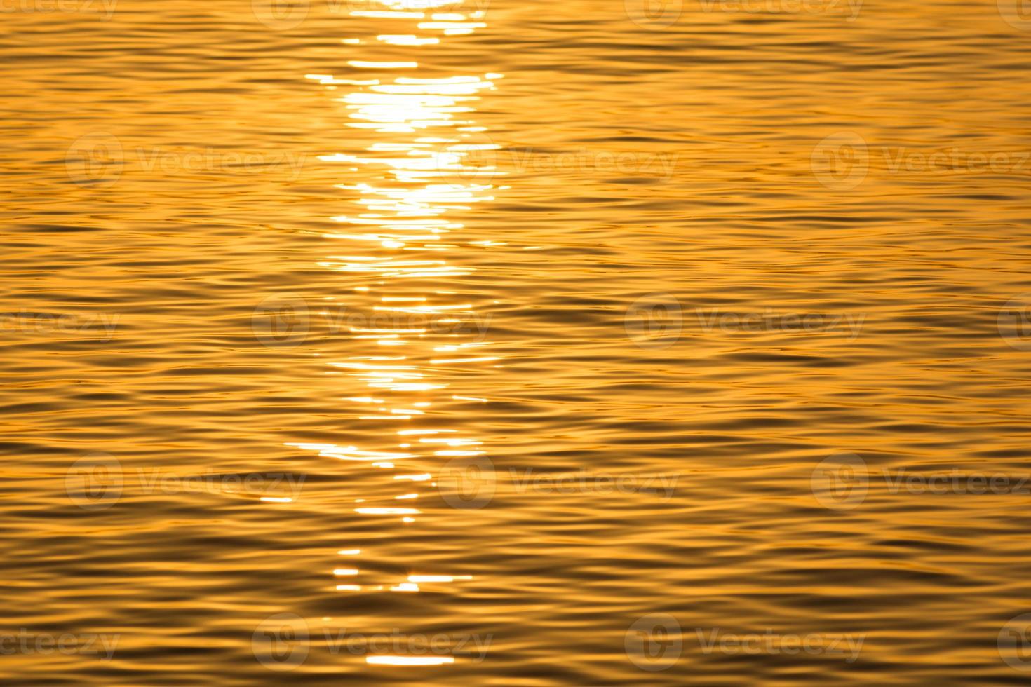 Scenic view of waves in sunset yellow light photo