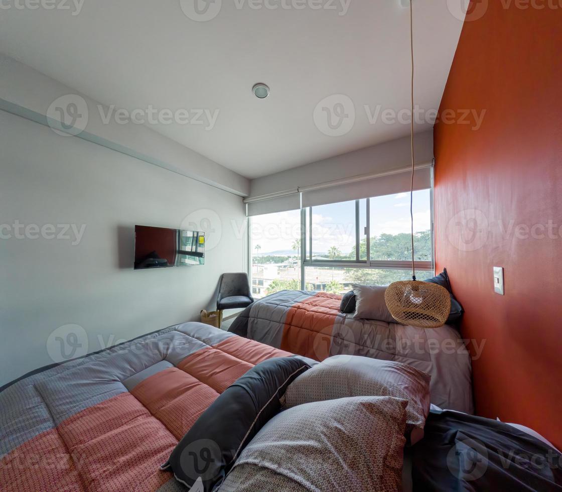 Hotel airbnb room with freshly made king sized bed with headboard, perfectly clean and ironed sheets photo