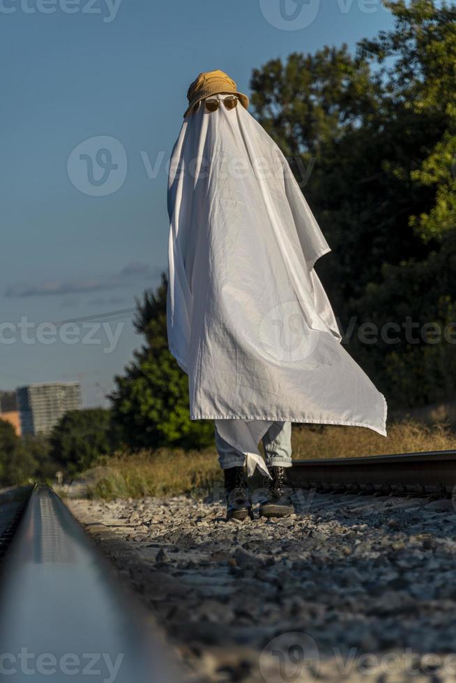 ghost standing around vegetation in broad daylight, at sunset, mexico photo