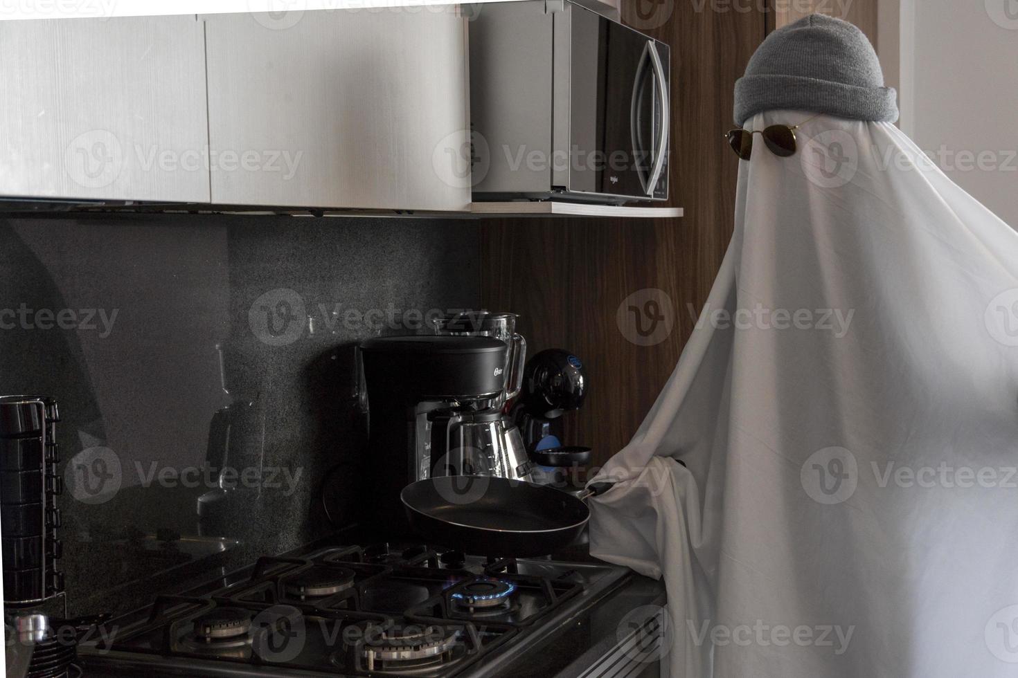 ghost cooking in a kitchen, modern kitchen, ghost white sheet, mexico latin america, mexico photo