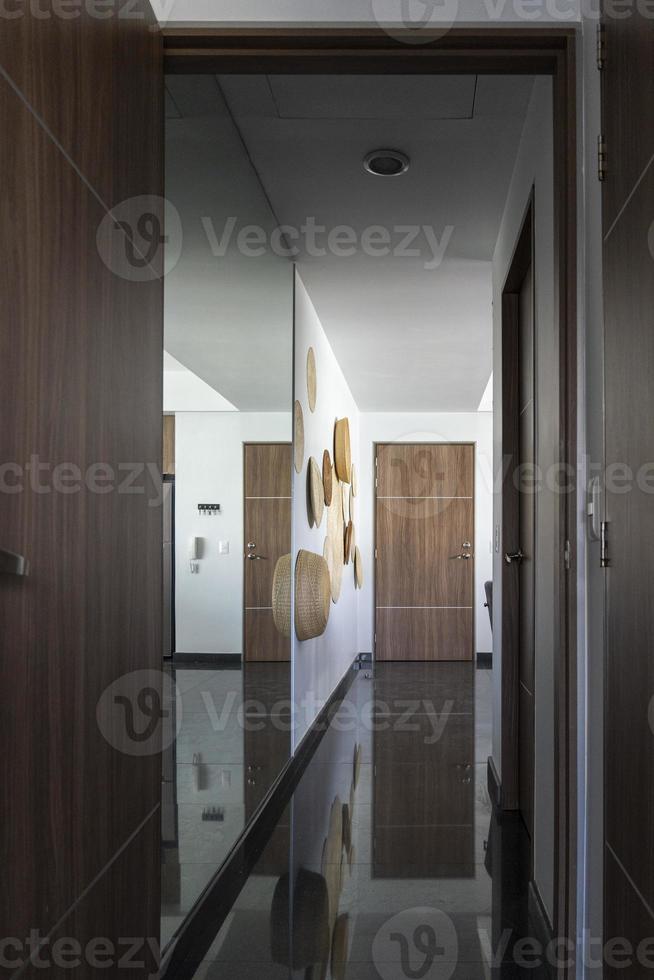 Hallway of an apartment modern design, wood, mexican decoration, granite floors photo