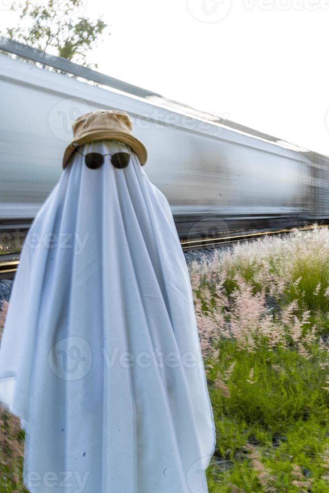 ghost standing around vegetation in broad daylight, at sunset, mexico photo