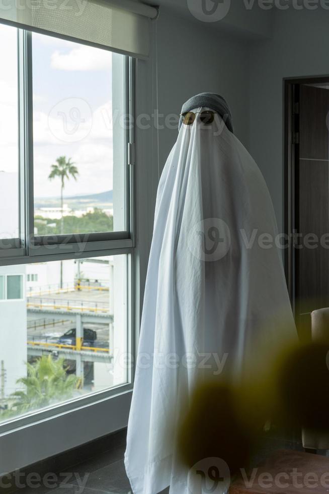 ghost standing around vegetation in broad daylight, at sunset, mexico photo