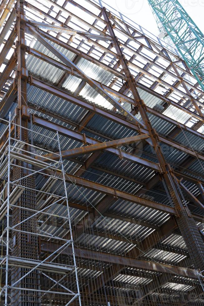 man welding steel on a girder at heights, building structure, mexico guadalajara photo