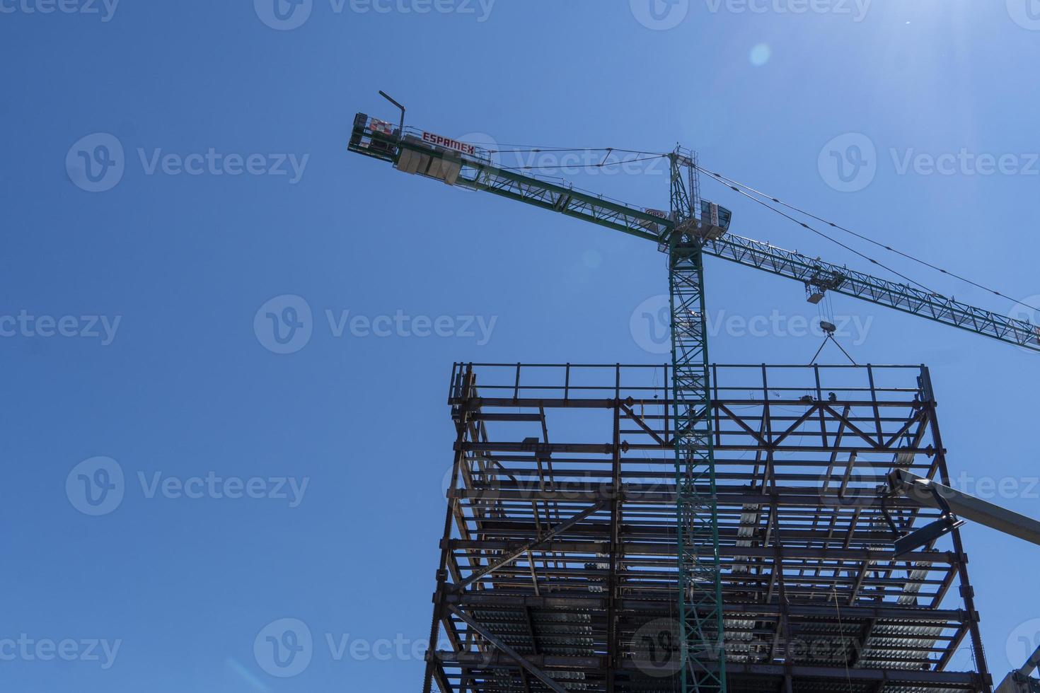 rusted steel structure while a man is welding joints, mexico guadalajara photo