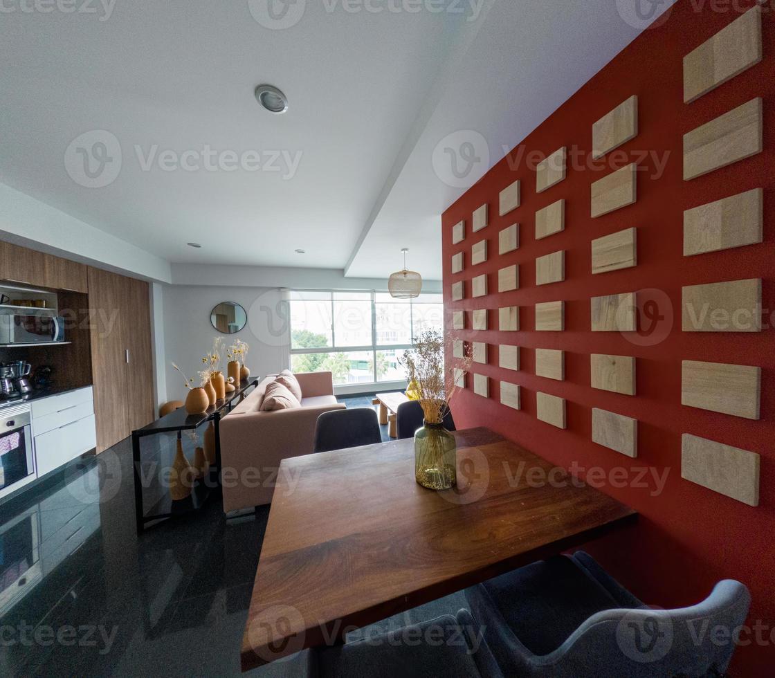 Beautiful living room interior in new luxury home with view of kitchen. Home interior photo