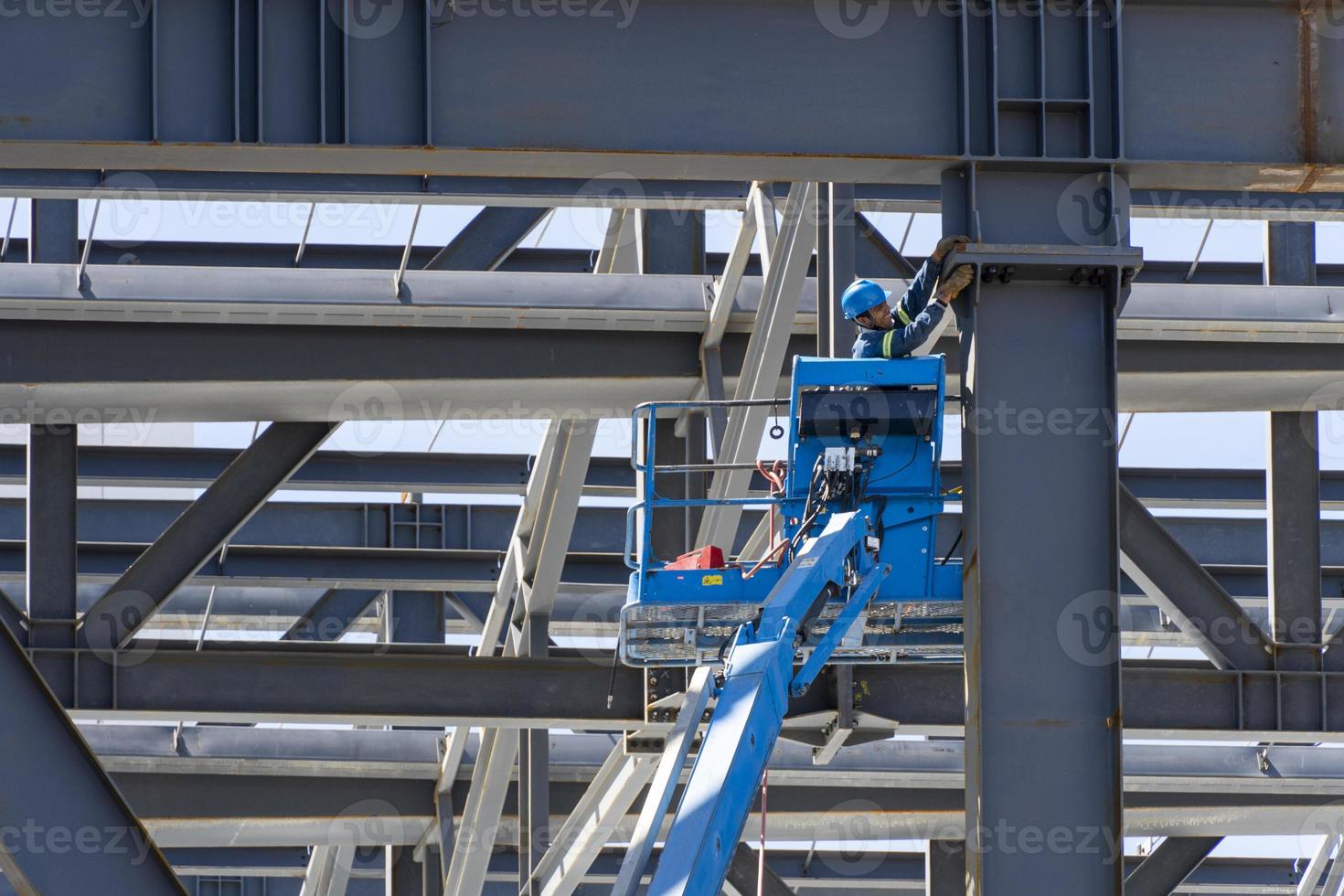 rusted steel structure while a man is welding joints, mexico guadalajara photo