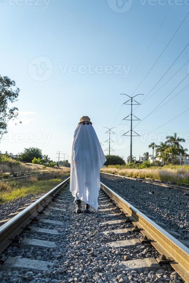 ghost standing around vegetation in broad daylight, at sunset, mexico photo