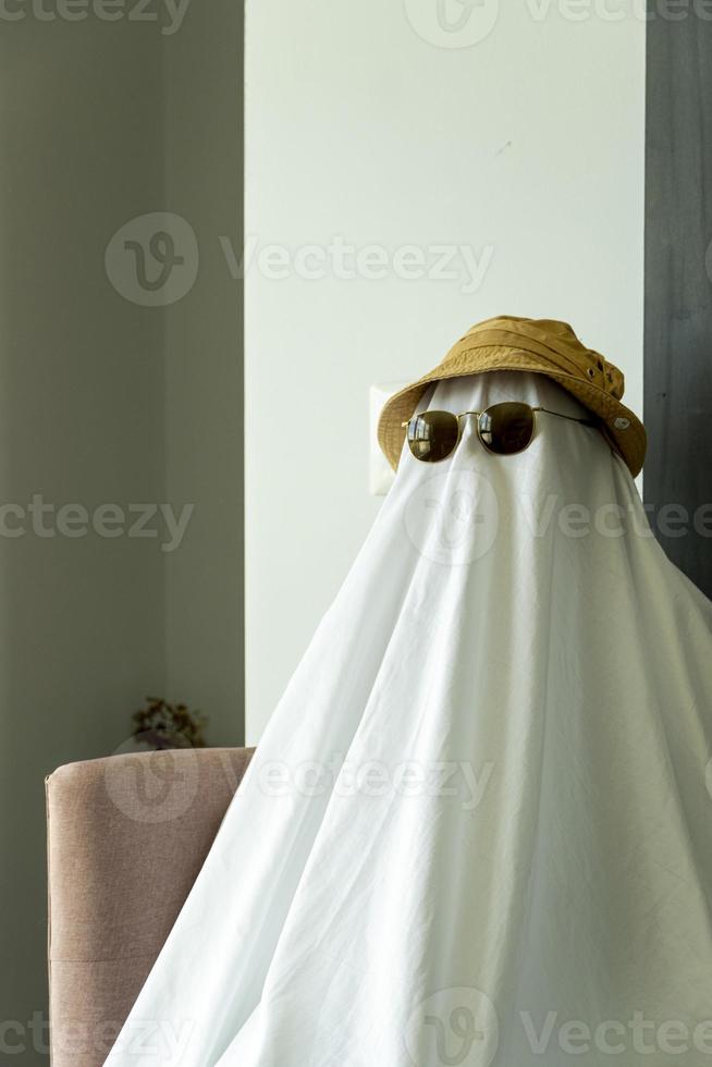 Happy Halloween. Cute funny Ghost against a textured old wall, vintage steel. Halloween happyl photo