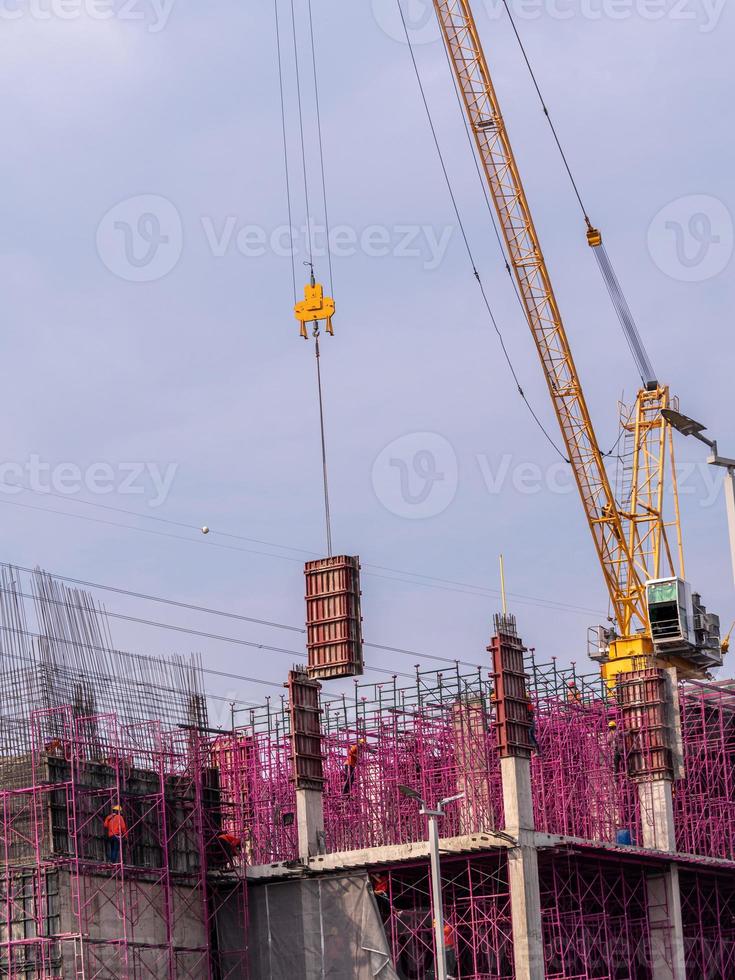 The pink scaffolding on the building under construction photo