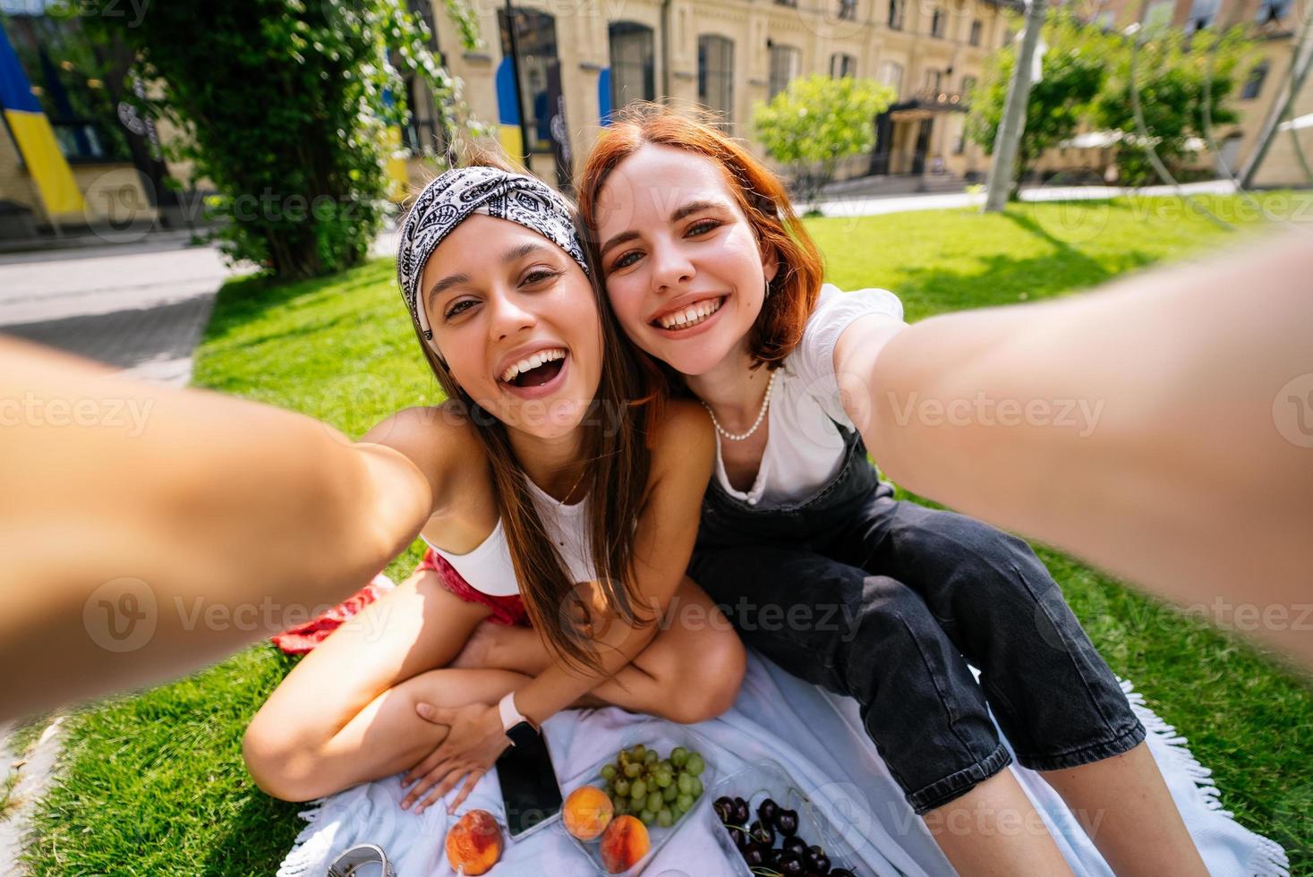 Beautiful women takes a picture with a wonderful park view photo