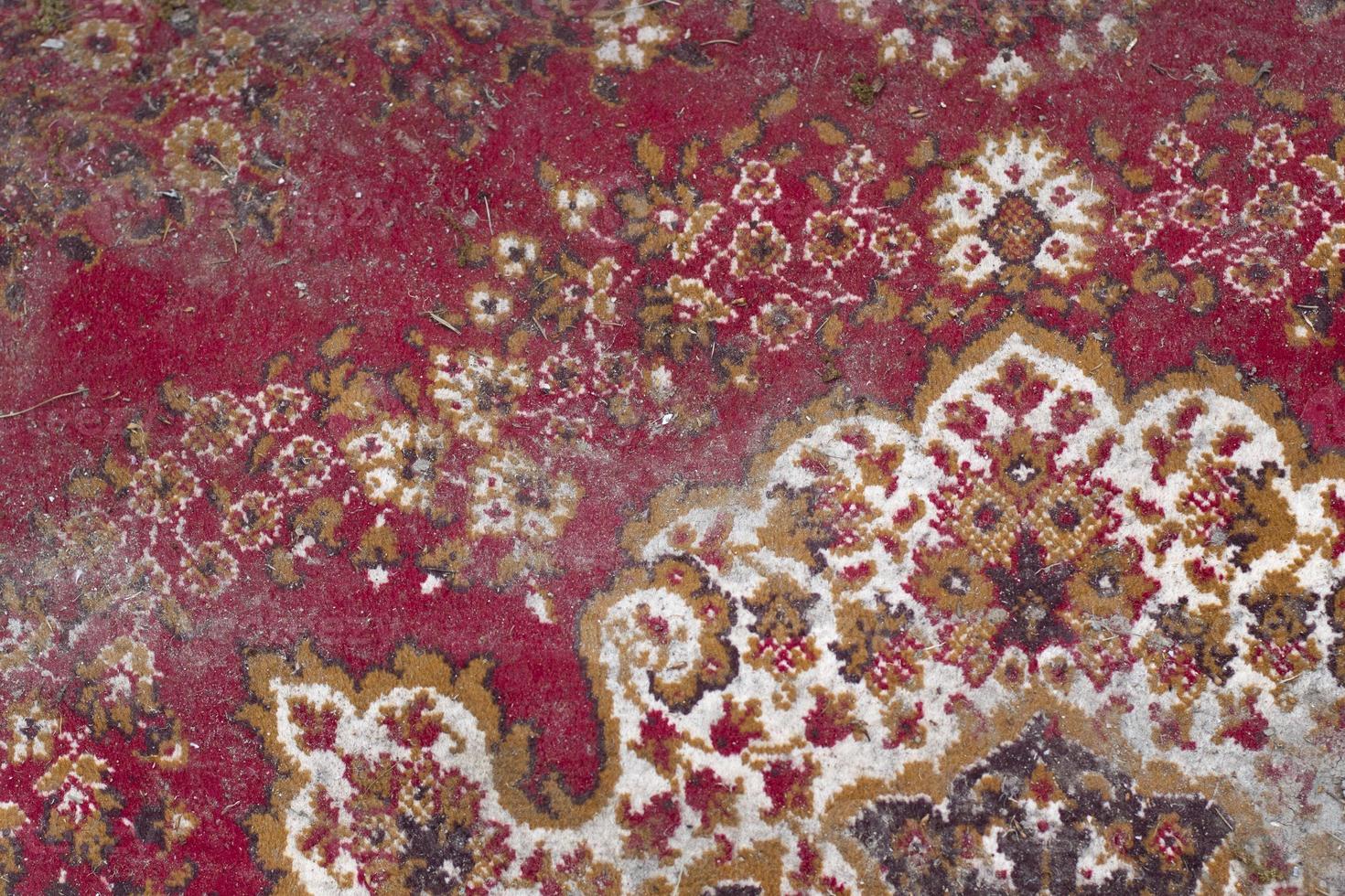 Carpet in mud. Dust on coating. Homemade carpet in Persian. photo