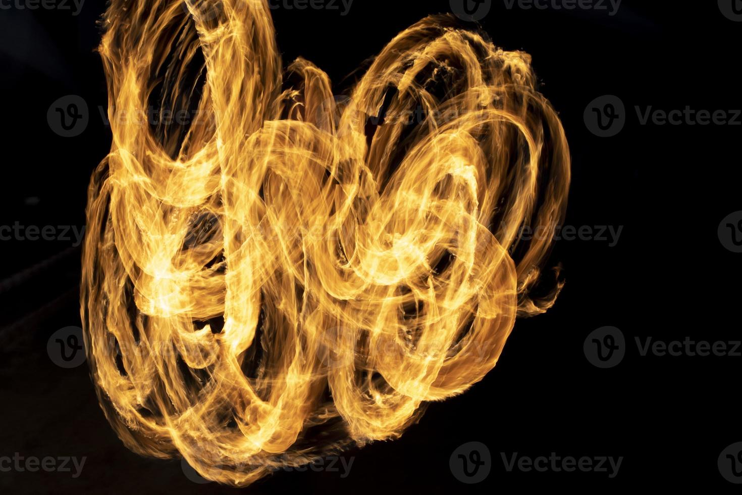 Lines of fire on black background. Flames in dark. photo
