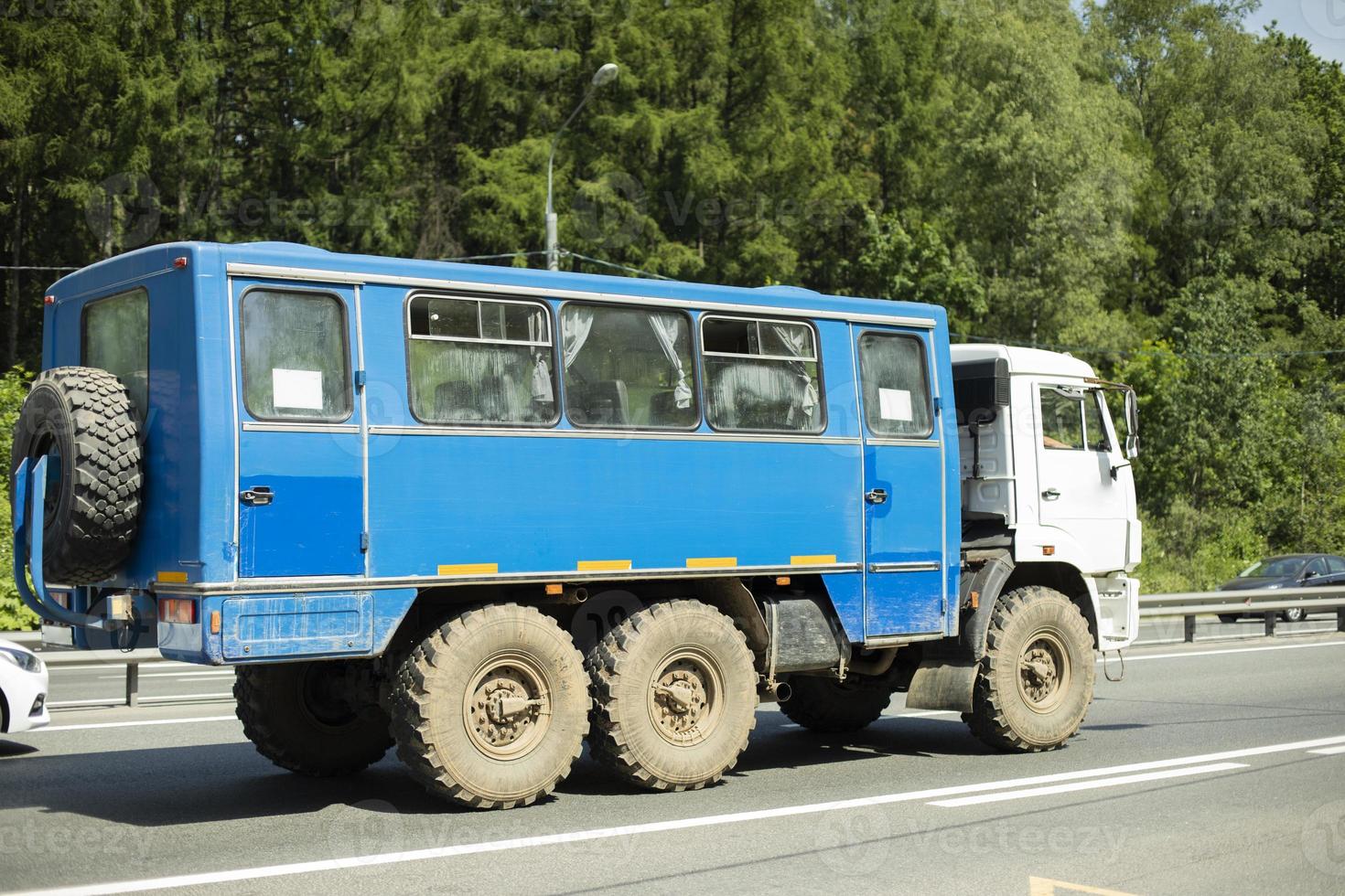 Truck on road. Car is driving on track. Transport with trailer. photo