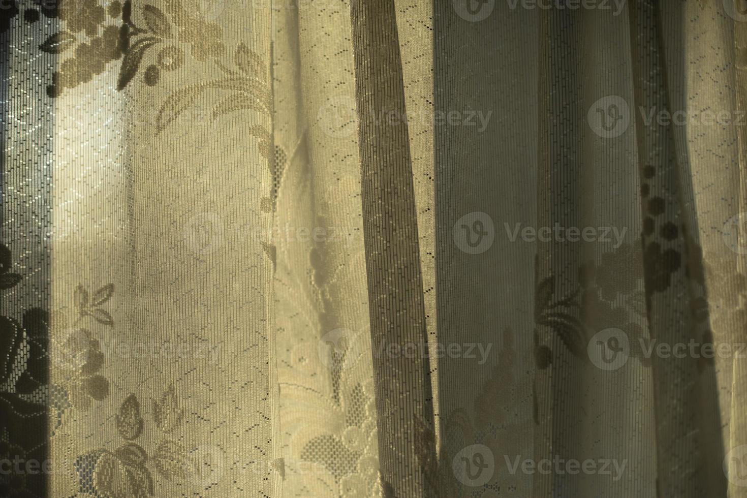 Curtains on window. Light through fabric. photo
