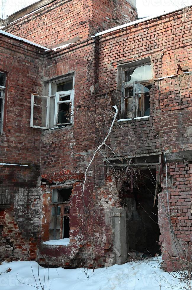 Fragment of an abandoned two-story building after military operations in Donetsk photo