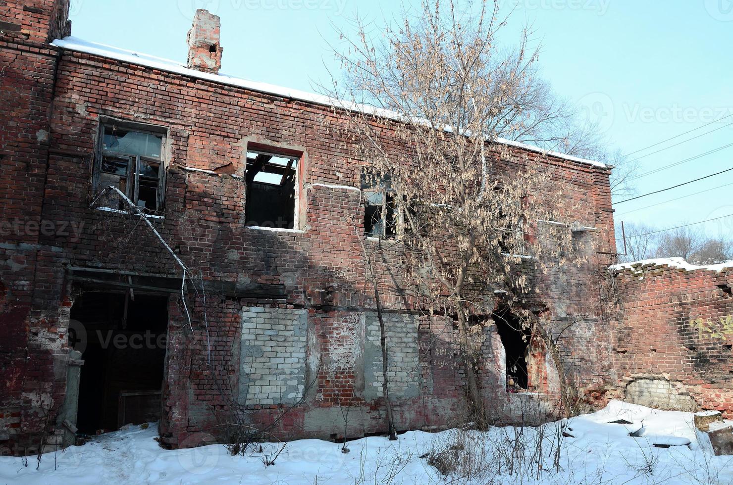 Fragment of an abandoned two-story building after military operations in Donetsk photo