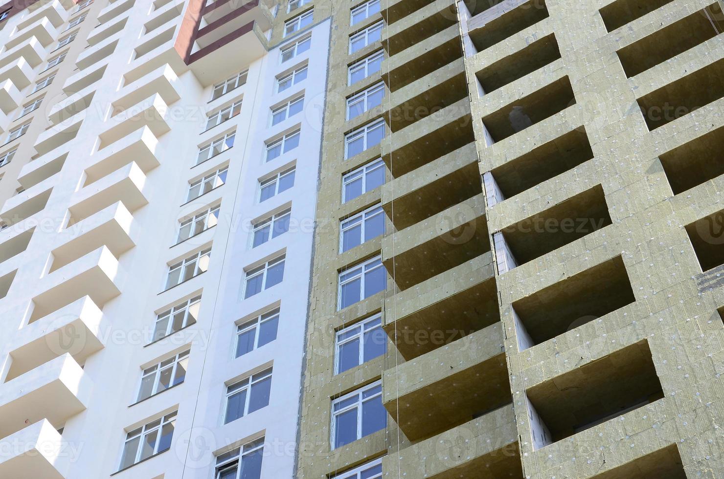 Residential multi store apartement building house facade under construction photo