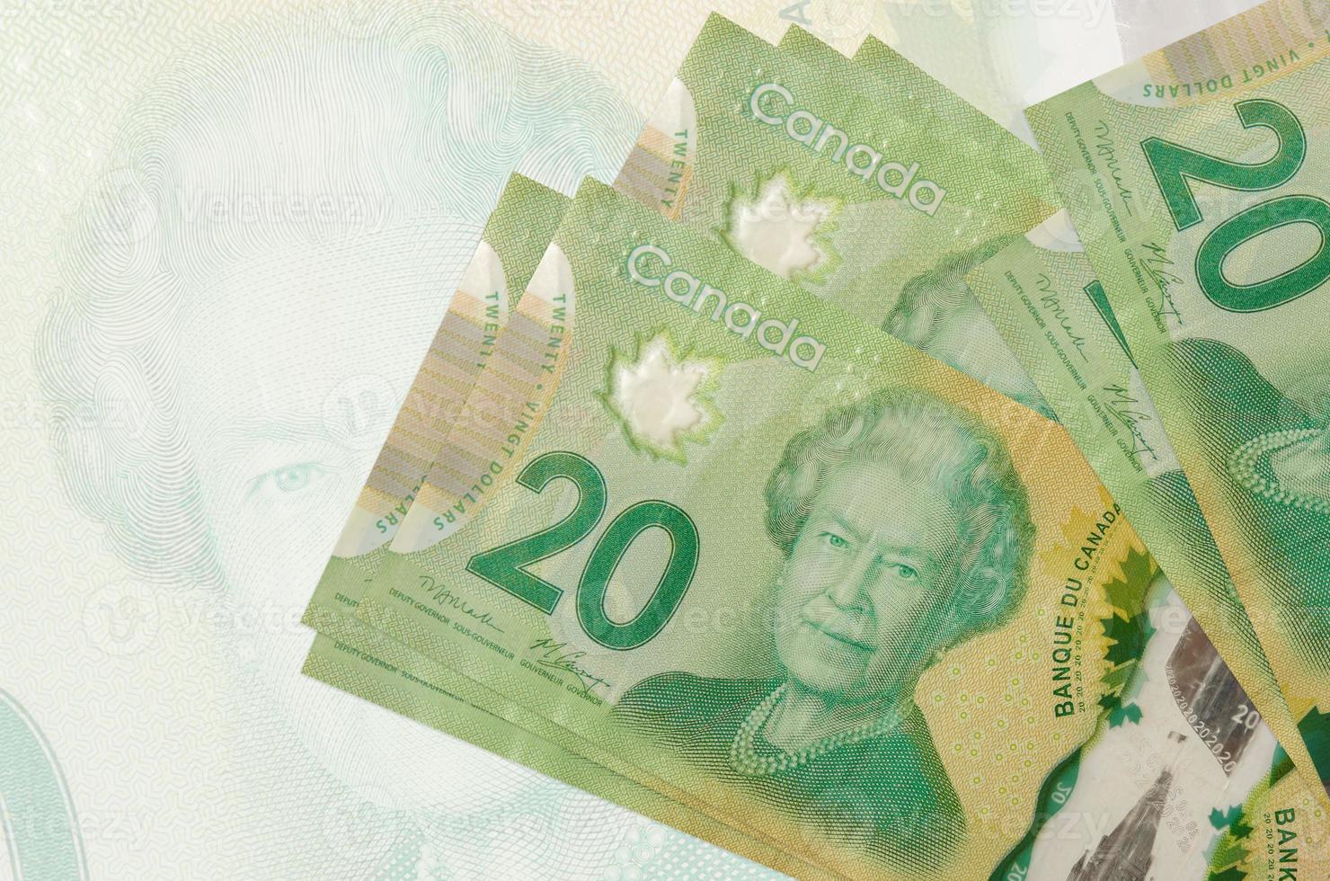 20 Canadian Dollars Bills Lies In Stack On Background Of Big Semi lot-of-70-canadian-dollars-and-43-british-pounds-property-room