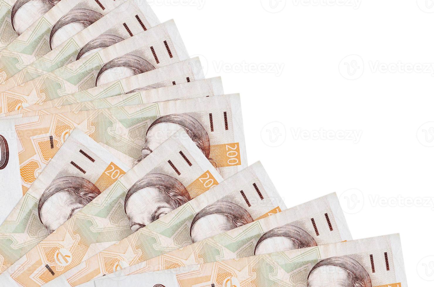 200 Czech korun bills lies isolated on white background with copy space stacked in fan close up photo