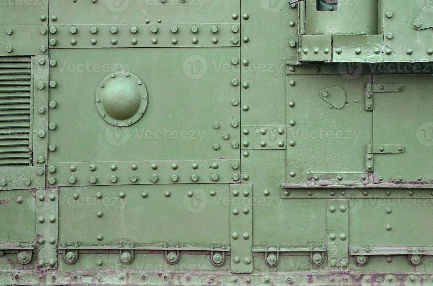 Abstract green industrial metal textured background with rivets and bolts photo