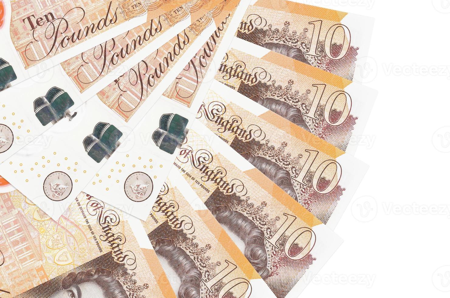 10 British pounds bills lies isolated on white background with copy space stacked in fan shape close up photo