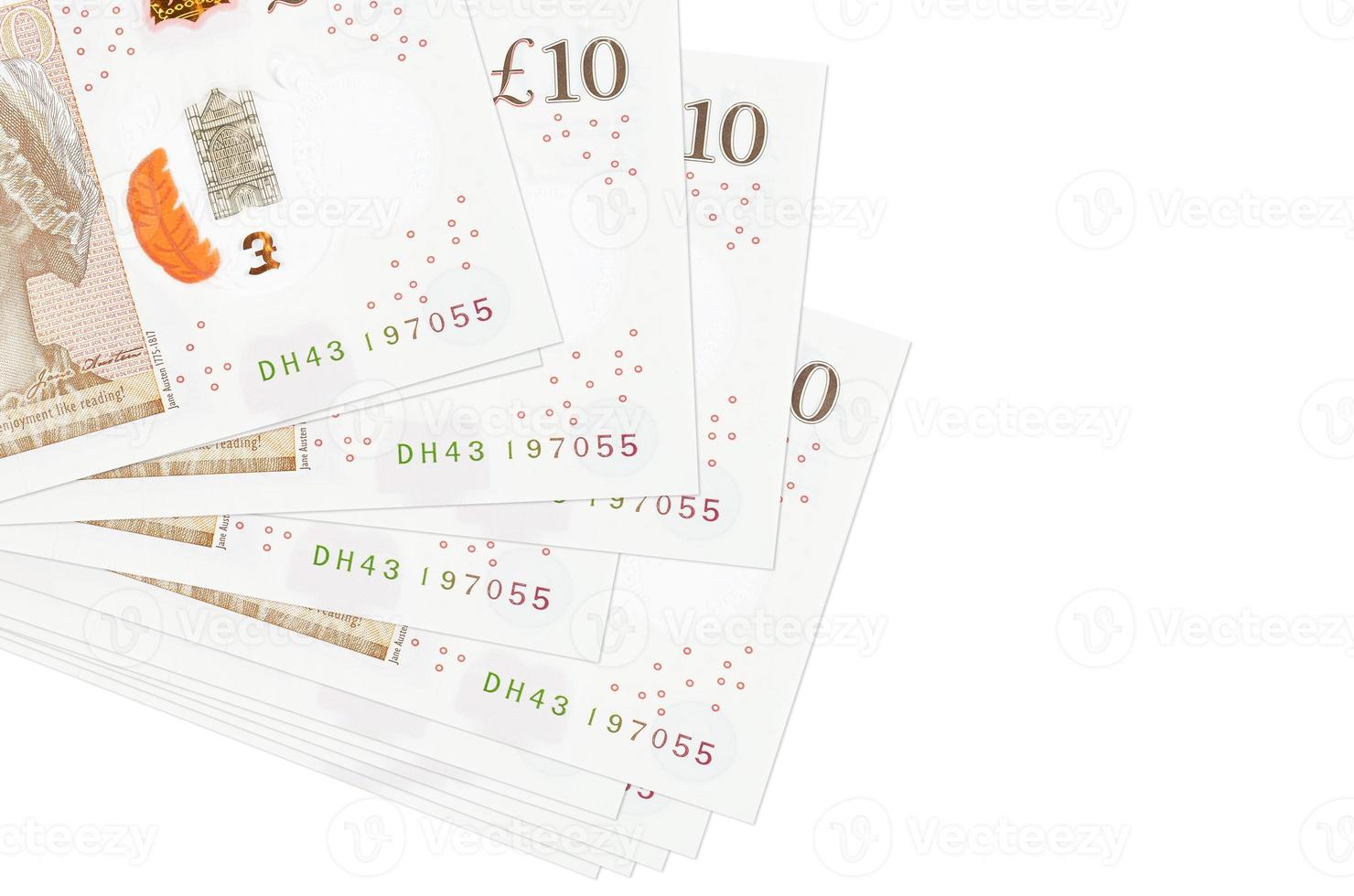 10 British pounds bills lies in small bunch or pack isolated on white. Mockup with copy space. Business and currency exchange photo