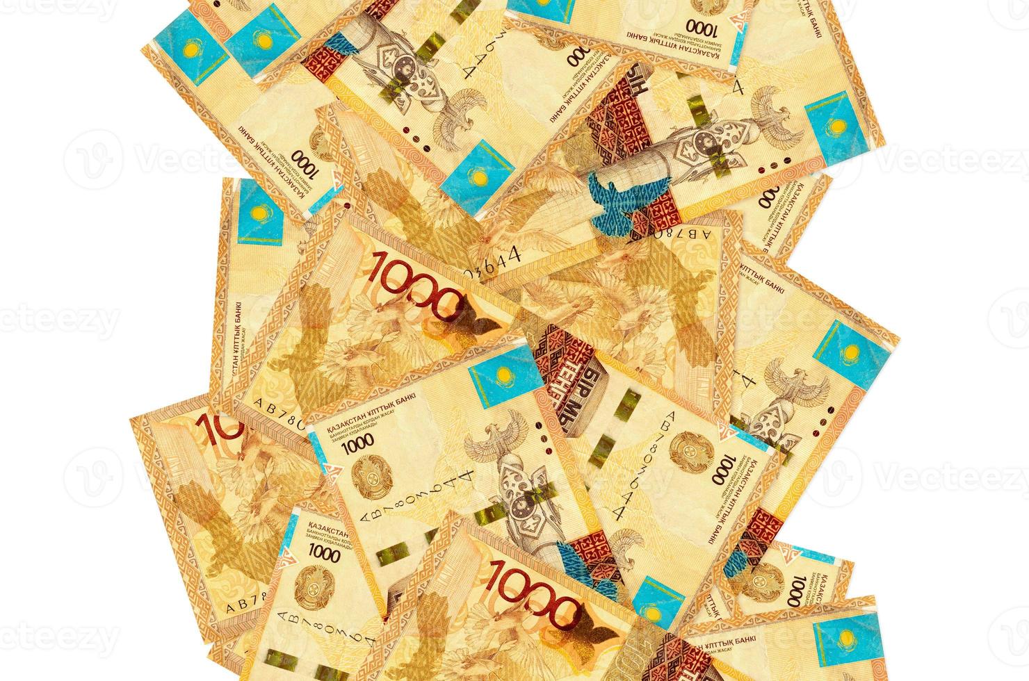 1000 Kazakhstani tenge bills flying down isolated on white. Many banknotes falling with white copyspace on left and right side photo