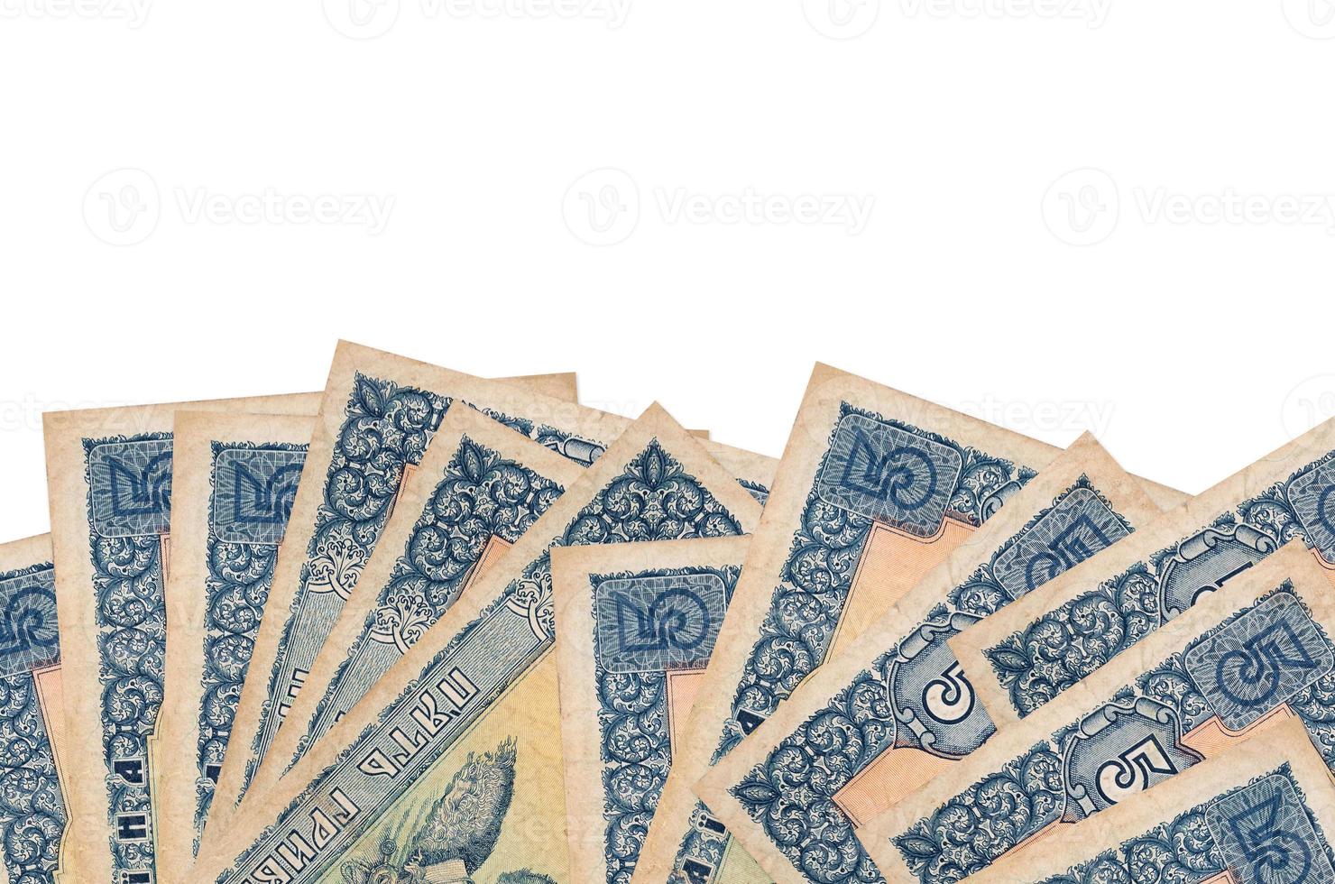 5 Ukrainian hryvnias bills lies on bottom side of screen isolated on white background with copy space. Background banner template photo