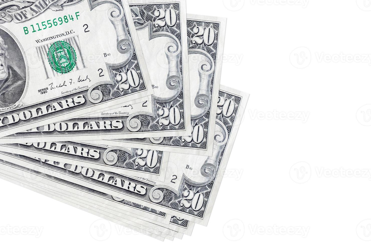 20 US dollars bills lies in small bunch or pack isolated on white. Mockup with copy space. Business and currency exchange photo