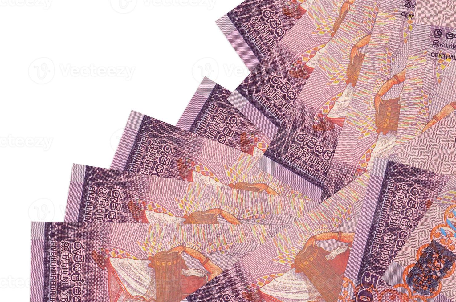 500 Sri Lankan rupees bills lies in different order isolated on white. Local banking or money making concept photo