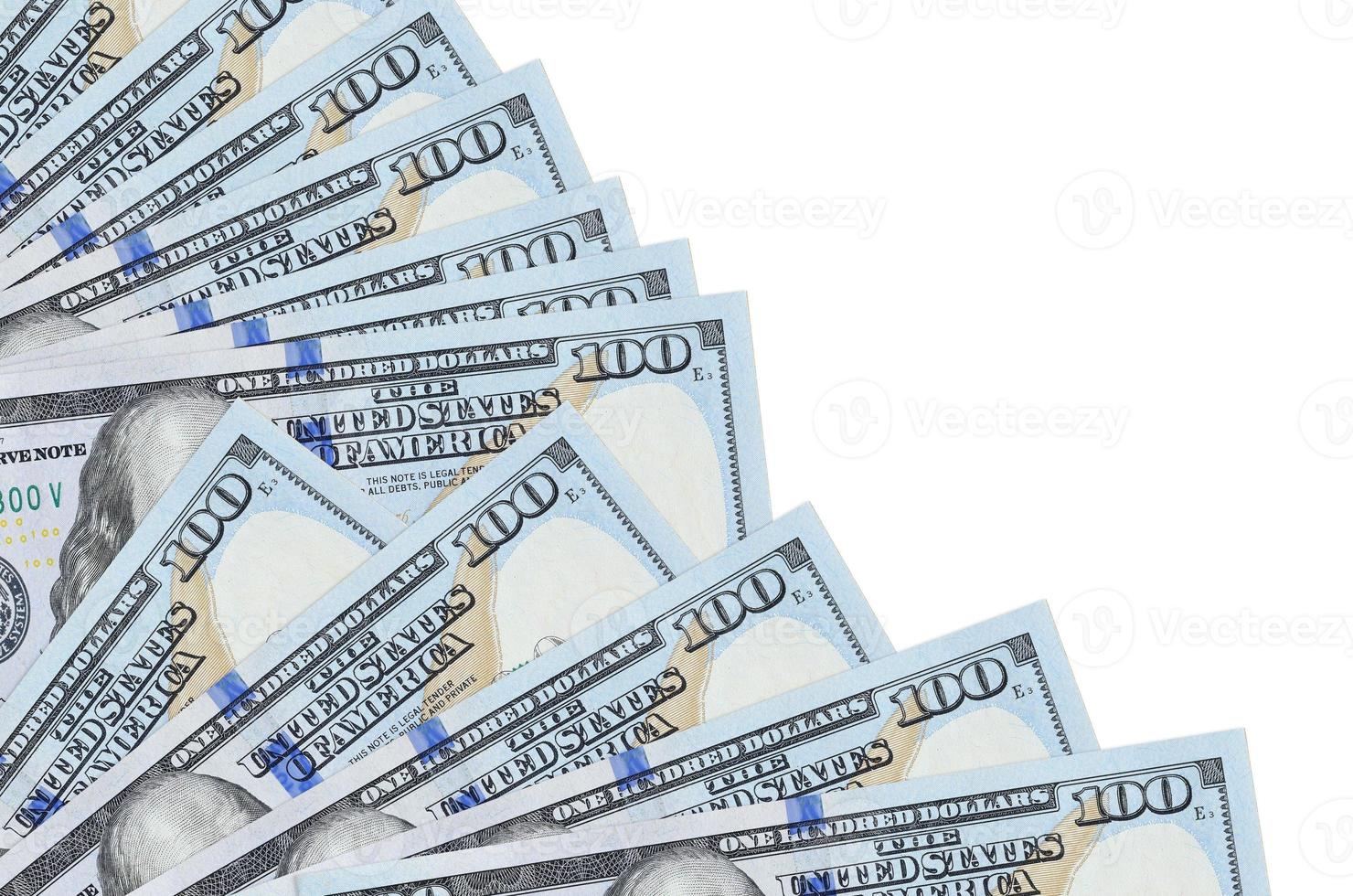 100 US dollars bills lies isolated on white background with copy space stacked in fan close up photo