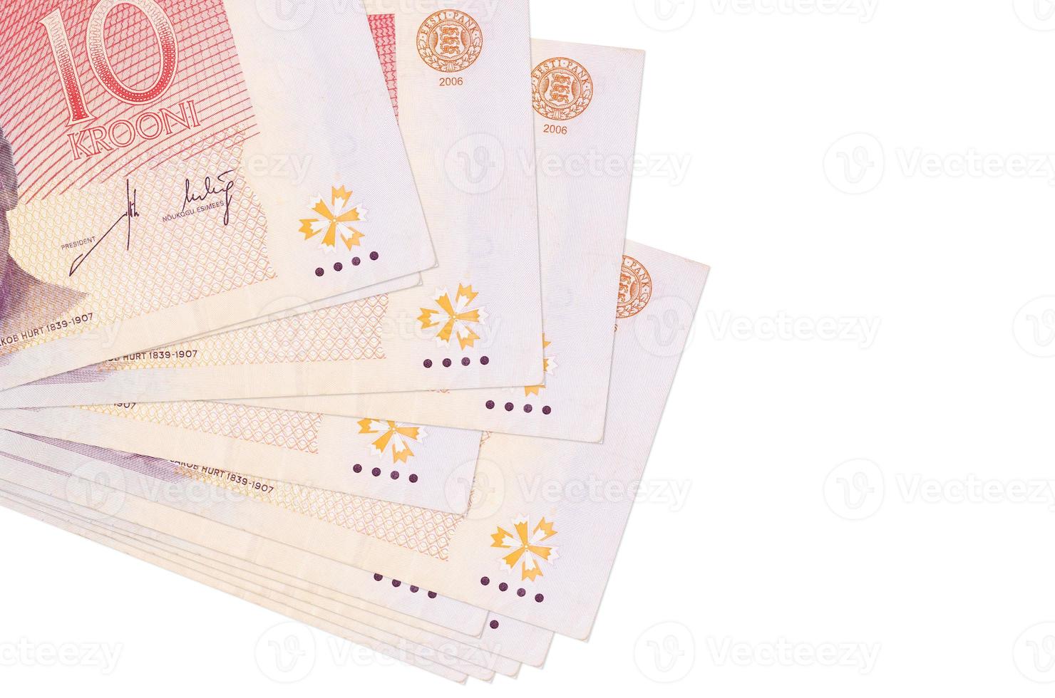 10 Estonian kroon bills lies in small bunch or pack isolated on white. Mockup with copy space. Business and currency exchange photo